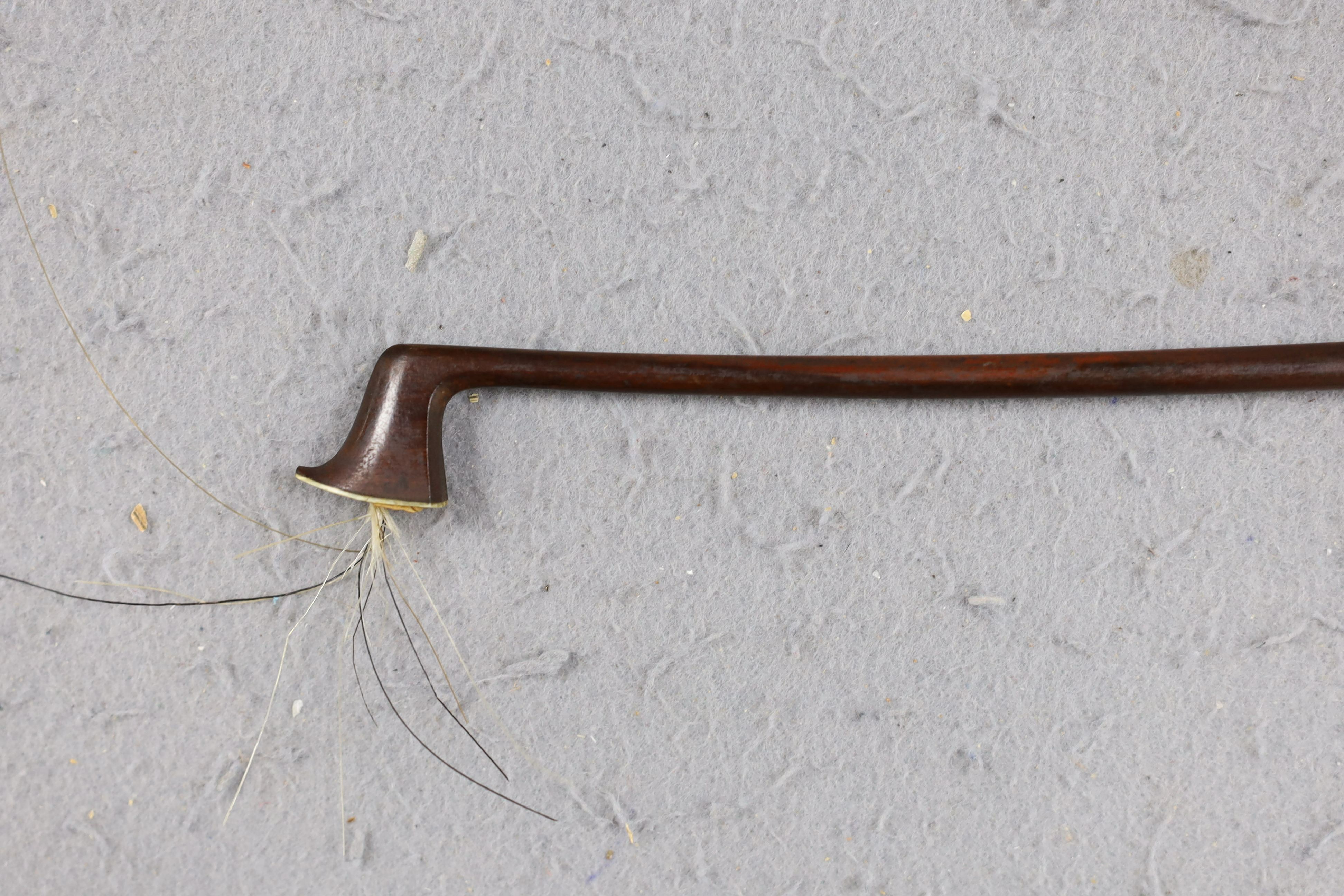 A cased 19th century violin, labelled Stradivarius 1690, with a Dodd bow